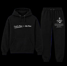 Load image into Gallery viewer, A two-piece black hoodie and sweatpants set with white graphic text and religious designs. The hoodie features the text 'God's Plan > My Plan' on the chest, and the sweatpants feature a mountain cross graphic with a Bible verse on the left thigh.